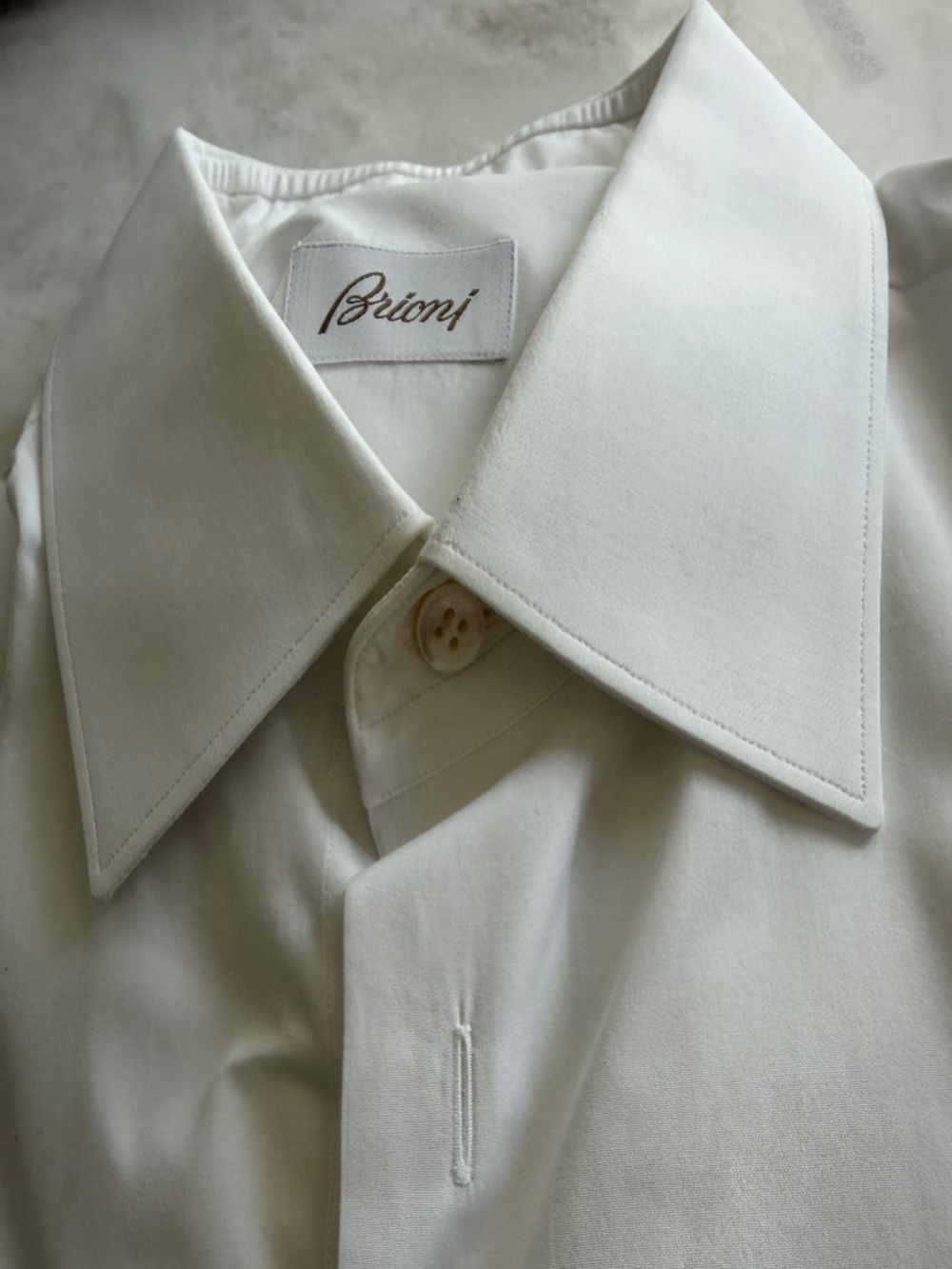 Man’s Brioni white shirt with French cuffs